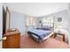 Bedroom with double bed and wood dresser at 11095 56Th N Ave, Seminole, FL 33772