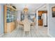 Dining room with a wooden table, chairs, and a view of the kitchen at 11095 56Th N Ave, Seminole, FL 33772