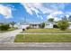 Gray house with a green lawn and a two-car garage at 11095 56Th N Ave, Seminole, FL 33772
