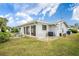 Back of house showing sliding doors and AC unit at 11095 56Th N Ave, Seminole, FL 33772