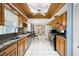 Kitchen with wood cabinets, granite counters and a breakfast nook at 11095 56Th N Ave, Seminole, FL 33772