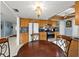 Kitchen features wood cabinets, granite counters, and a breakfast nook at 11095 56Th N Ave, Seminole, FL 33772