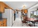 Bright kitchen with wood cabinets, granite counters, and eat-in area at 11095 56Th N Ave, Seminole, FL 33772