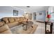 Living room with tiled floors and a large, comfortable couch at 11095 56Th N Ave, Seminole, FL 33772