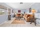 Spacious living room featuring a tan couch and tiled floors at 11095 56Th N Ave, Seminole, FL 33772
