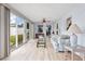 Bright sunroom with sliding doors opening to backyard at 11095 56Th N Ave, Seminole, FL 33772