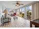 Sunroom with access to backyard, plenty of natural light, and seating at 11095 56Th N Ave, Seminole, FL 33772