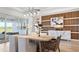Modern dining room with wood table and wicker chairs at 14451 Coastal Woodland Ln, Parrish, FL 34219