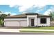 Beautiful one-story home with three-car garage and landscaping at 14451 Coastal Woodland Ln, Parrish, FL 34219