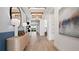 Elegant hallway with hardwood floors and artwork at 14451 Coastal Woodland Ln, Parrish, FL 34219