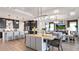 Open concept kitchen with island and breakfast bar at 14451 Coastal Woodland Ln, Parrish, FL 34219