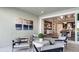 Relaxing outdoor patio with seating and views into the home at 14451 Coastal Woodland Ln, Parrish, FL 34219