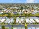 Aerial view of canal-front home with lush landscaping and boat dock access at 2322 Riverbluff Pkwy # V250, Sarasota, FL 34231