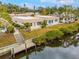 Aerial view of a waterfront property with private dock and access to the canal at 2322 Riverbluff Pkwy # V250, Sarasota, FL 34231