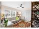 Bedroom with white built-ins, a comfy couch and patterned rug at 2322 Riverbluff Pkwy # V250, Sarasota, FL 34231