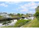 Peaceful canal view showcasing a boat lift and neighboring properties at 2322 Riverbluff Pkwy # V250, Sarasota, FL 34231