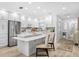 Modern kitchen featuring white cabinets and a large island at 2322 Riverbluff Pkwy # V250, Sarasota, FL 34231
