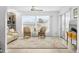 Relaxing living room with wicker chairs and a floral rug at 2322 Riverbluff Pkwy # V250, Sarasota, FL 34231