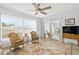 Sunroom with wicker furniture and access to a patio at 2322 Riverbluff Pkwy # V250, Sarasota, FL 34231
