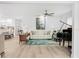 Light-filled living room featuring hardwood floors and a comfy sofa at 2322 Riverbluff Pkwy # V250, Sarasota, FL 34231