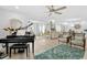 Bright living room with hardwood floors, comfy seating, and large windows at 2322 Riverbluff Pkwy # V250, Sarasota, FL 34231