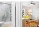 View of living room and bathroom with patterned rug at 2322 Riverbluff Pkwy # V250, Sarasota, FL 34231
