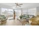 Peaceful sunroom with wicker furniture and water views at 2322 Riverbluff Pkwy # V250, Sarasota, FL 34231