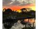 Stunning sunset over canal; property features private boat dock at 2322 Riverbluff Pkwy # V250, Sarasota, FL 34231