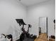 Home gym with stationary bike and full-length mirror at 6107 S 4Th St, Tampa, FL 33611