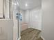 Bathroom with soaking tub, walk-in shower, and linen closet at 13 Perimeter Dr, Englewood, FL 34223