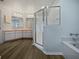 Bathroom with updated vanity, shower, and bathtub at 13 Perimeter Dr, Englewood, FL 34223