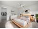 Bright bedroom with light wood platform bed and walk-in closet at 13 Perimeter Dr, Englewood, FL 34223