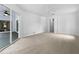 Spacious bedroom with patio access and ceiling fan at 13 Perimeter Dr, Englewood, FL 34223