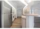 Modern kitchen with stainless steel appliances and breakfast bar at 13 Perimeter Dr, Englewood, FL 34223