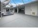 Screened patio with hot tub and spacious seating area at 13 Perimeter Dr, Englewood, FL 34223