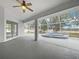 Screened-in lanai with a relaxing spa and backyard access at 13 Perimeter Dr, Englewood, FL 34223