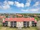 Aerial view of an apartment building with red tile roofs and balconies at 2400 Feather Sound Dr # 613, Clearwater, FL 33762