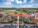 Aerial view of condo building near golf course and water at 2400 Feather Sound Dr # 613, Clearwater, FL 33762