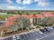 Condo building with courtyard fountain and parking at 2400 Feather Sound Dr # 613, Clearwater, FL 33762