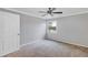 Cozy bedroom with neutral walls, carpeting and a ceiling fan at 2400 Feather Sound Dr # 613, Clearwater, FL 33762