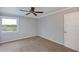 Bright bedroom with neutral walls, carpeting and a ceiling fan at 2400 Feather Sound Dr # 613, Clearwater, FL 33762