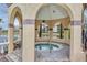Hot tub in a covered gazebo with a view of the lake at 2400 Feather Sound Dr # 613, Clearwater, FL 33762