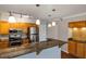 Modern kitchen with stainless steel appliances and granite countertops at 2400 Feather Sound Dr # 613, Clearwater, FL 33762