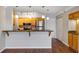 Open kitchen with breakfast bar and stainless steel appliances at 2400 Feather Sound Dr # 613, Clearwater, FL 33762