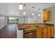 Kitchen with granite countertops, stainless steel appliances, and golf course view at 2400 Feather Sound Dr # 613, Clearwater, FL 33762