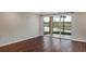 Living room with golf course view and sliding glass doors at 2400 Feather Sound Dr # 613, Clearwater, FL 33762
