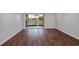 Bright living room with hardwood floors and access to patio at 2400 Feather Sound Dr # 613, Clearwater, FL 33762