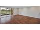 Living room with wood-look floors and view of the golf course at 2400 Feather Sound Dr # 613, Clearwater, FL 33762