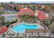 Resort-style pool with lounge chairs and a pergola at 2400 Feather Sound Dr # 613, Clearwater, FL 33762