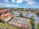 Two well-maintained tennis courts near the clubhouse at 2400 Feather Sound Dr # 613, Clearwater, FL 33762